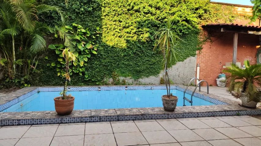 Foto Casa Com Piscina No Jardim Tropical NI Carolina